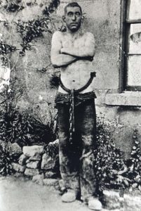 Miner wearing the guss and crook. It was used mainly by child miners (carting boys) for over 350 years. It consisted of a guss (rope girdle around the waist) and a crook (hook passing between legs) to pull heavy coal carts through narrow seams.