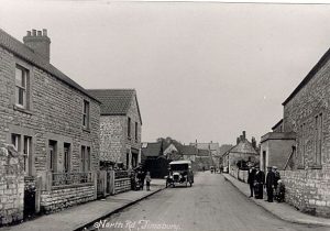 This picture shows the Co-Op before alterations to the front were made. The corrugated iron building next to the Co-Op later became the YMCA.