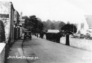 Car parked outside the Coombs's shop in North Road