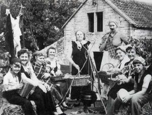Women's Institute Carnival Float for a village fete in the 1950s. Left to right are: Andrew Pickford, Margaret Pickford, Kitty Hodder, Isobel Tucker, Ivy Tucker, unknown, Winifred Watts, Betty Bridges, Vera Tompkins and Peter Tompkins.