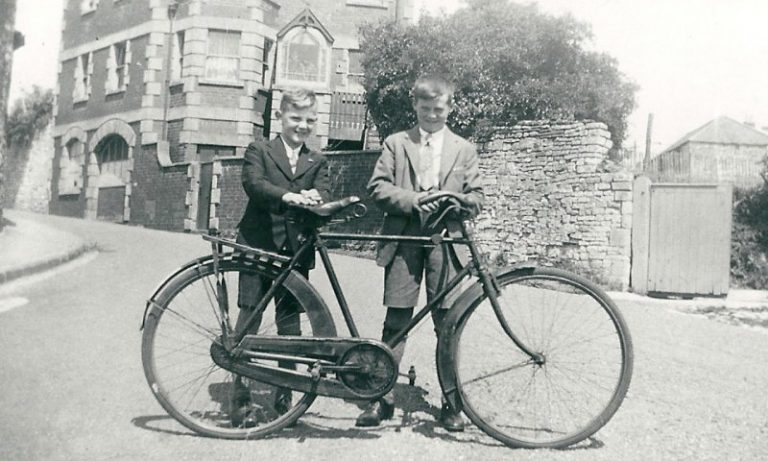 Two young boys on Church Hill. The one on the right is Jake Moxham son of the village blacksmith who worked himself at the forge in Church Lane. He was the brother of Rhona Moxham. The one on the left is Dennis Bush who became landlord of the Seven Stars.