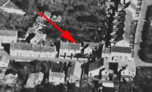 The original cottages on the site of Rono Place. The current building was originally built by Maurice Moon as a paint, wallpaper and building accessories store. Upstairs there was a joinery for his business. Also there was a showroom for kitchen and bathroom equipment. Subsequently it became a general stores run by the Kosmalahs, who came from Poland, and then became Plumbs before being taken over by Smile Stores, McColls and The Spar. The upper floor was used by DB Joinery then John Ashley's electronics business and later was used as a hairdressers - Overheads.